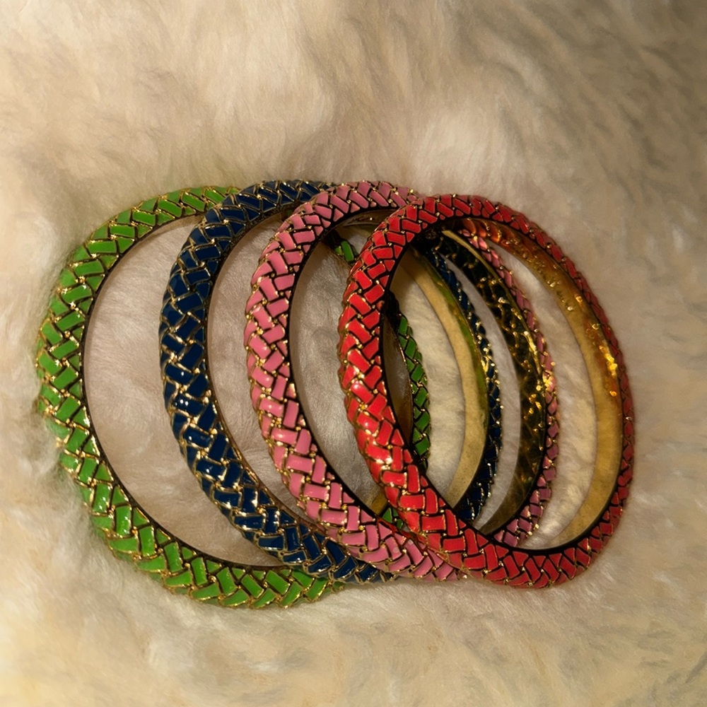 Four Lilly Pulitzer bangle bracelets.  
Pink, blue, coral and green